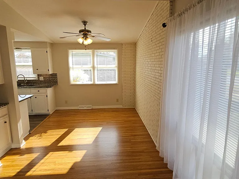 Dinning Area, cabinet and ceiling fan.