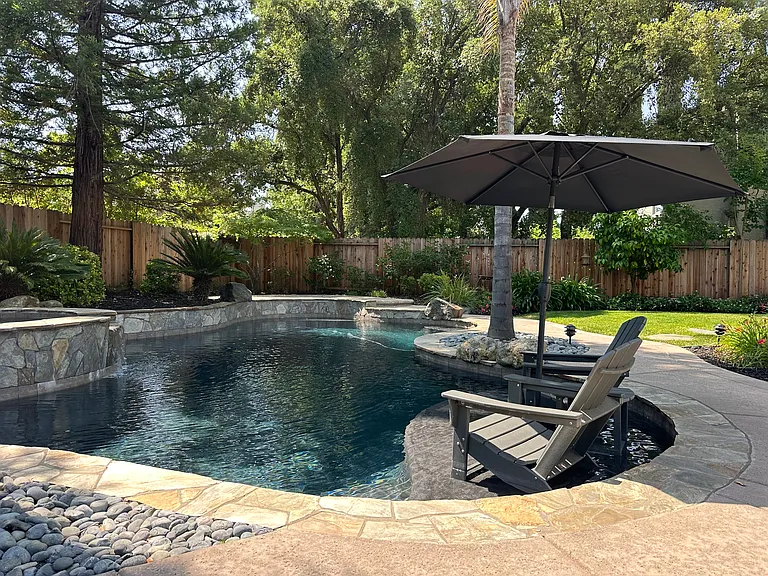 Waterfall spa with Baja shelve for lounging