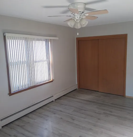 The bedroom is huge with windows on 2 sides.
