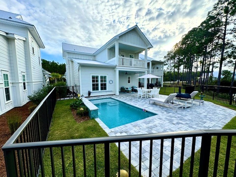 Two covered backyard spaces, maintenance free yard, outdoor dining area