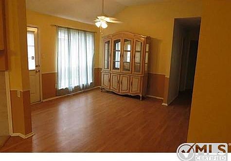Formal dinning room with door that opens to a patio.