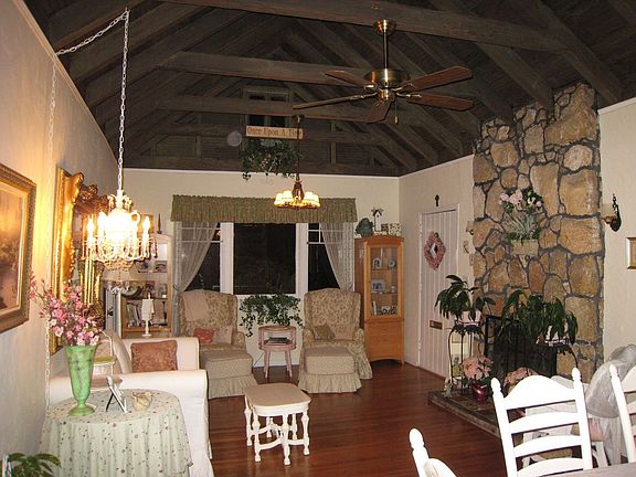 Living Room (26' x 13') with Original Fireplace