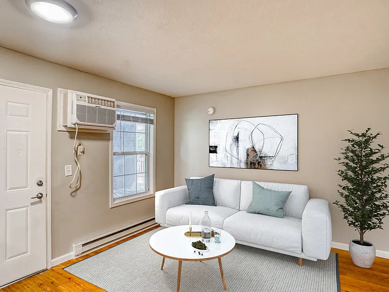 Elevate your lifestyle at McCarty Place Apartments, where modern comfort meets stylish design. This cozy living space features contemporary decor and generous natural light. Explore your new home today and schedule a tour!