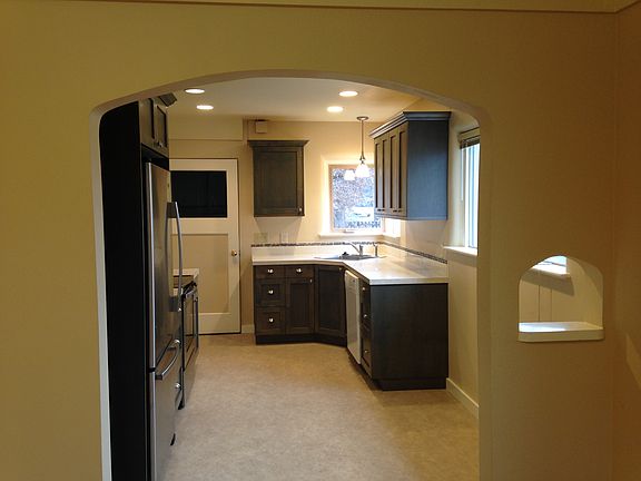 Kitchen. The door leads to attached garage and basement.