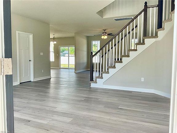 Foyer open to grand stair case.