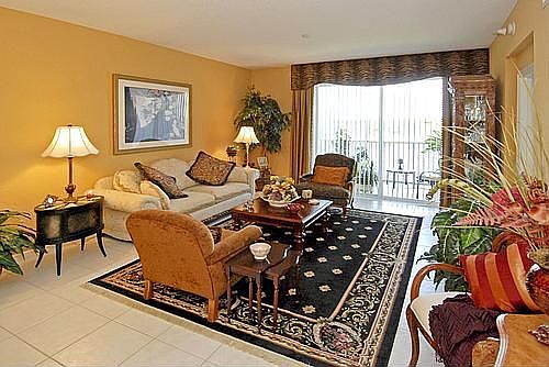 Spacious living room with impact sliders and luxurious window treatments