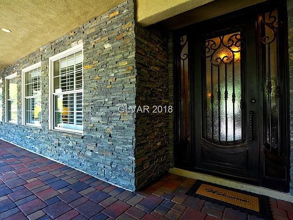 Covered front porch with custom entry over $12,000 spent on the beautiful front door