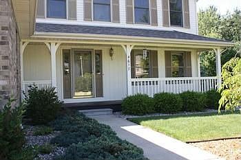 Sweet front porch welcomes you to this family home.