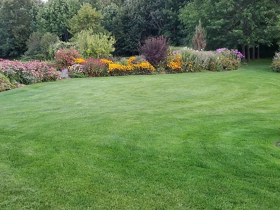 Sweeping lawn and gardens