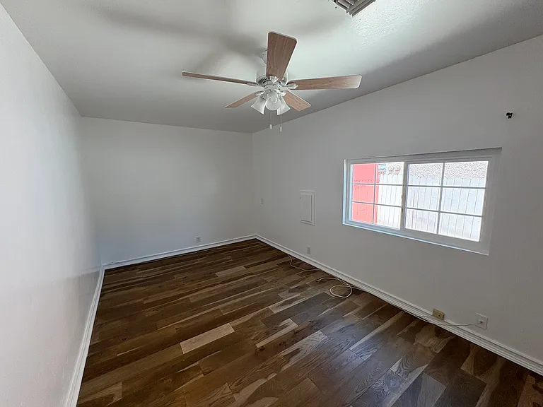 Spacious main bedroom with built-in closet and washer and dryer.