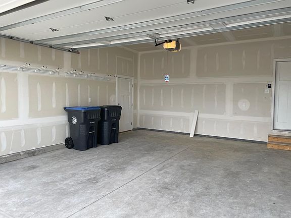 Full 2 car, attached garage also features direct access to backyard through service door.