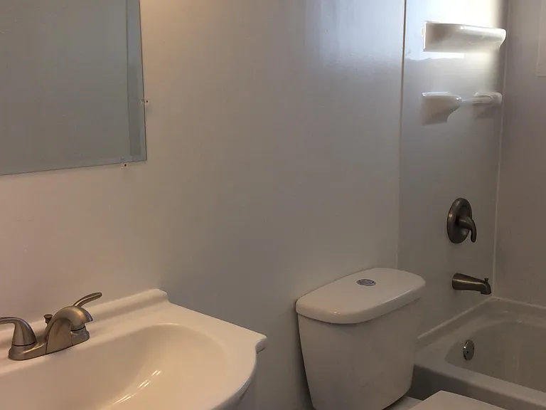 Completely remodeled bathroom with new tub, toilet, vanity,