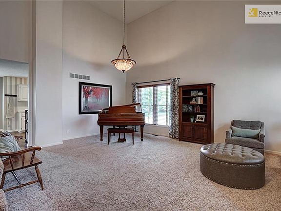 The large great room can be configured so many ways! This piano area would be the perfect spot for a dining room table, too!