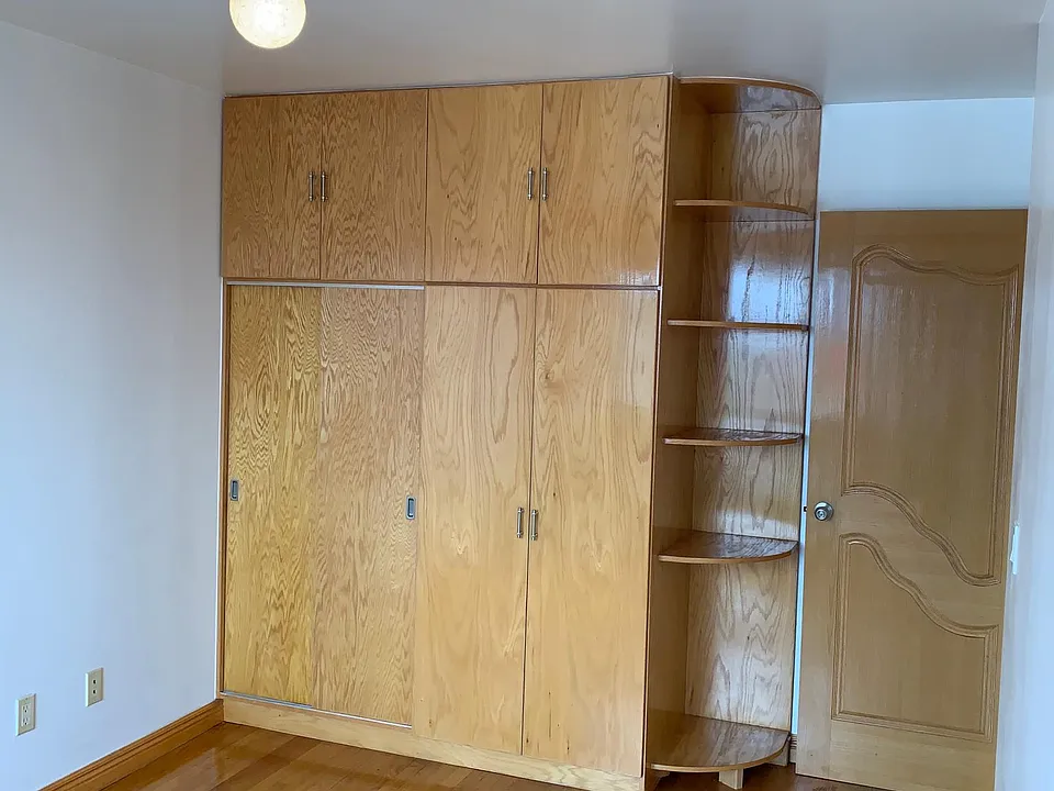 Custom made closet, cabinet and shelf set in bedroom one
