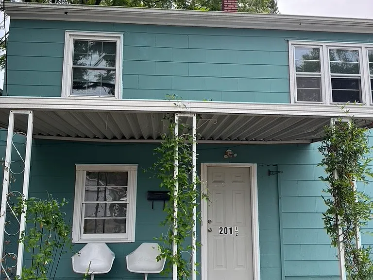 Dedicated entry with driveway to the right. Second story apartment.
