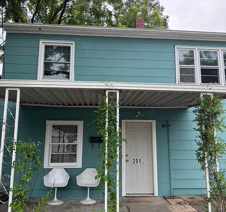 Dedicated entry with driveway to the right. Second story apartment.