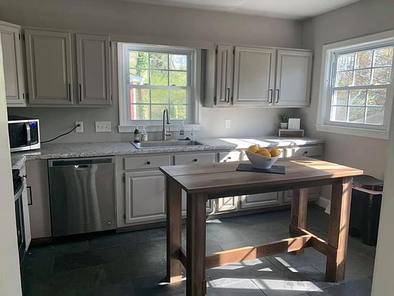 updated kitchen with slate floors & new back door