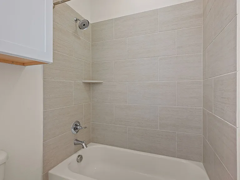 Bedroom #1 en suite full bathroom with shower and tub