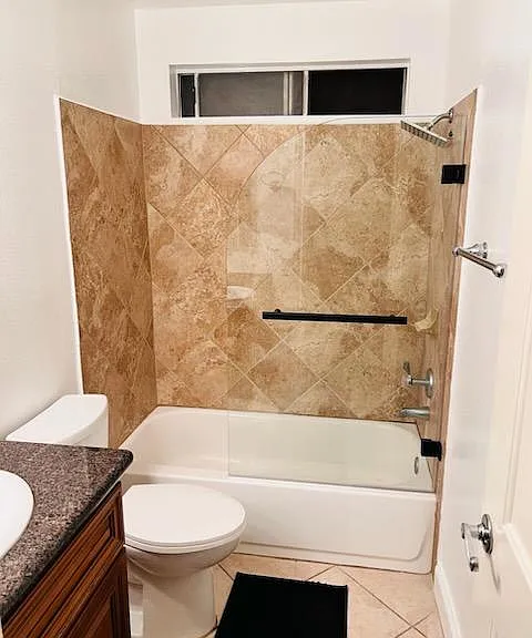Modern guest bathroom featuring a clean, updated design with ample storage and a spacious layout. Conveniently located near the second bedroom, making it perfect for guests or shared living.
