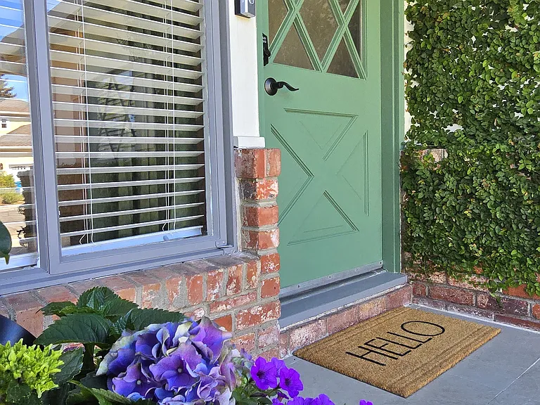 Classic brick traditional facade. Real stone porch with serene neighborhood views.