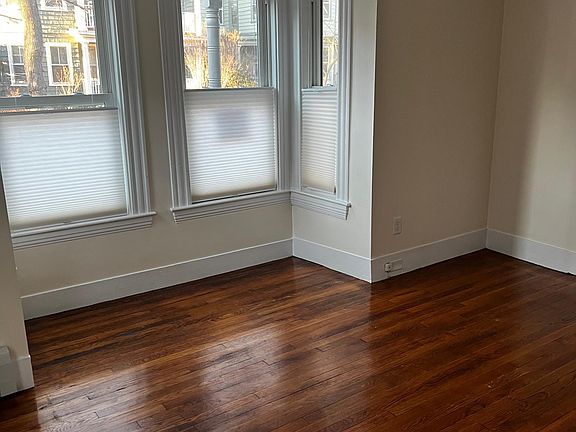 Living room from inside corner, view is of street, room is about 12'x13'