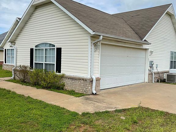 siding and brick 3 bedroom 2 bath on acre land