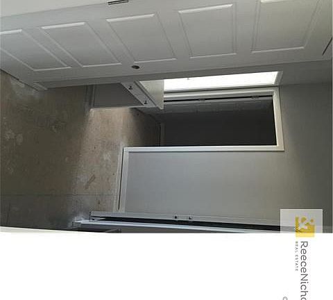 Built in desk, coat closet and boat bench off garage