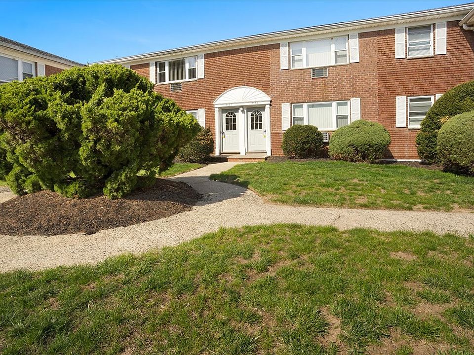 Brick building and landscaped grounds