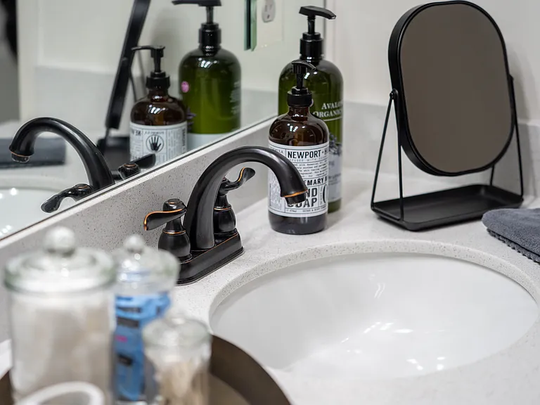 Pamper yourself with our curated bathroom amenities, featuring premium soaps, fresh towels, and a dedicated vanity mirror for your morning routine