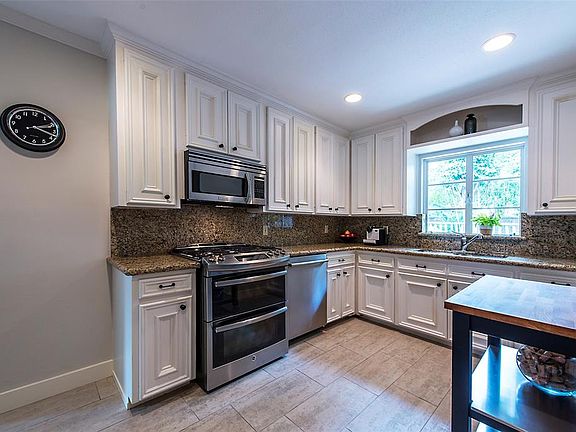 Kitchen looks onto back yard