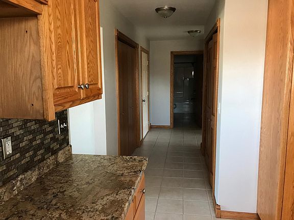 Hallway to bathroom, bedrooms, laundry and garage. 