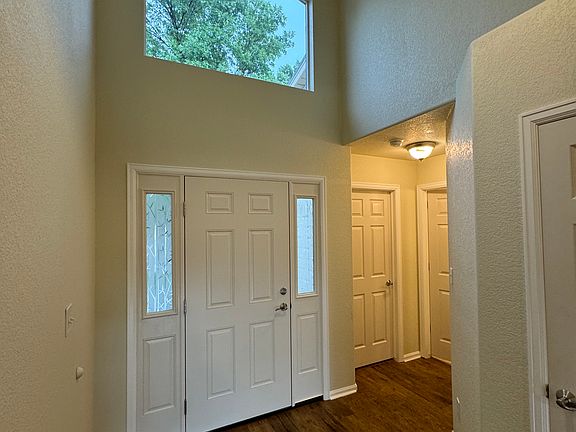 Entry with tall ceilings and natural light.