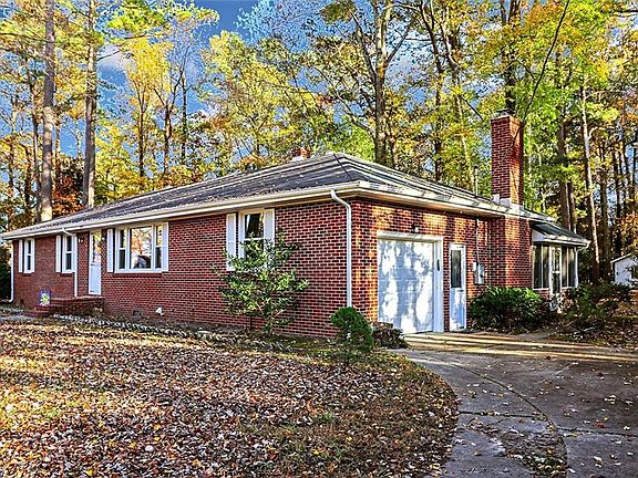 Tucked away on a quiet street in Deep Creek and situated on a private and wooded 1.5 acre lot.