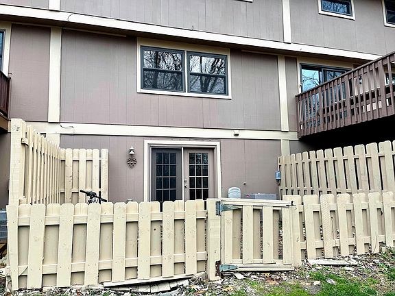 Walkout enclosed back patio overlooks wooded lot!