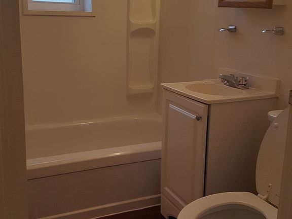bathroom tub refinished wood floor