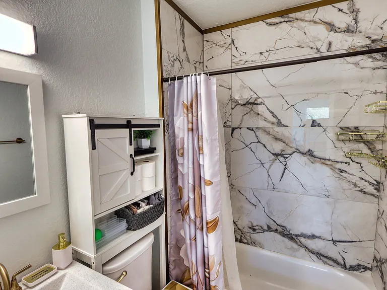 Unit is professionally staged; furniture and decor shown in photos are not included. Rented unfurnished.