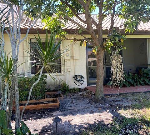 Back of villa with screen porch