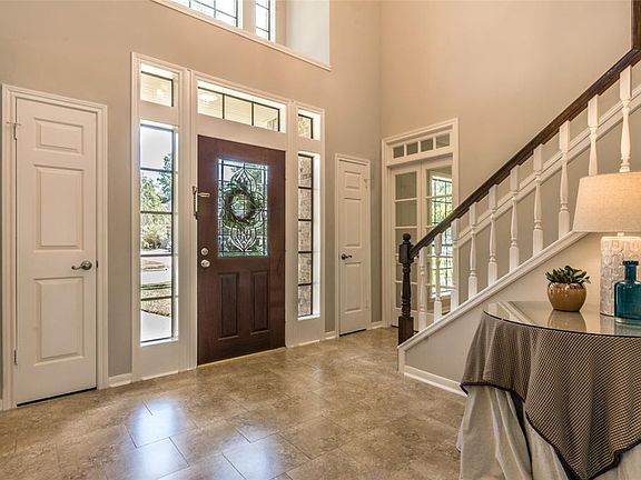 The entrance hall is light and bright with lovely leaded glass front door. This home has NO carpet!