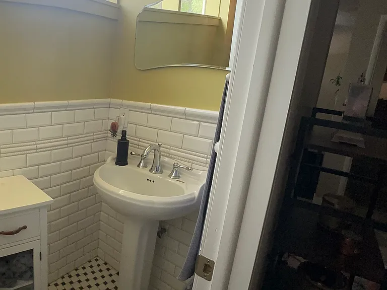 1/2 Bathroom includes toilet, sink and some storage