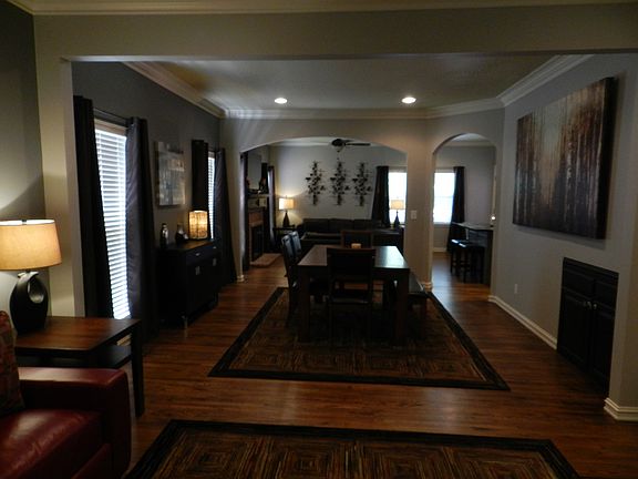 Living Room Open to Dining Room Which Opens to Family Room and Kitchen.