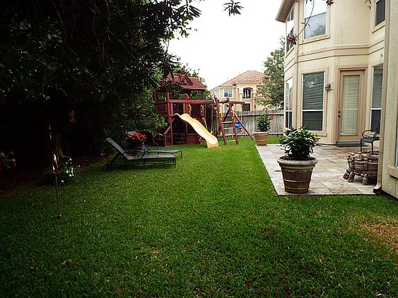 Plenty of green space with a play gym. Stays with property if wanted.