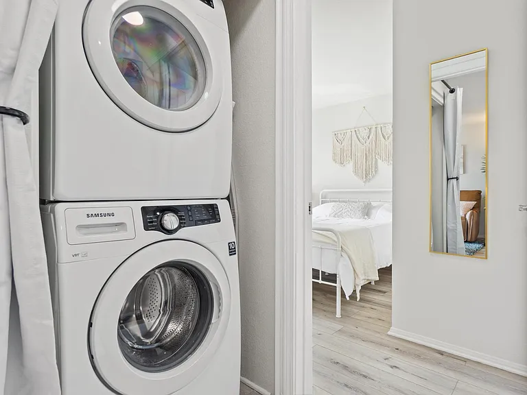 In-unit stacked full-size washer and dryer