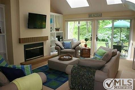 Living room with access to stone patio