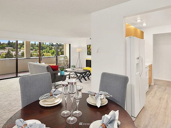 Looking Toward Living Room and Deck from Dining Area , Kitchen to Right>