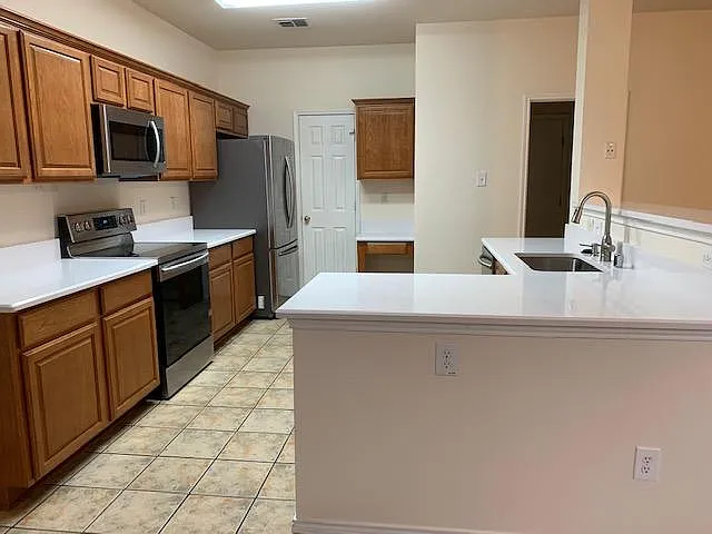 View of kitchen from eat in kitchen area. Nice quartz counters
