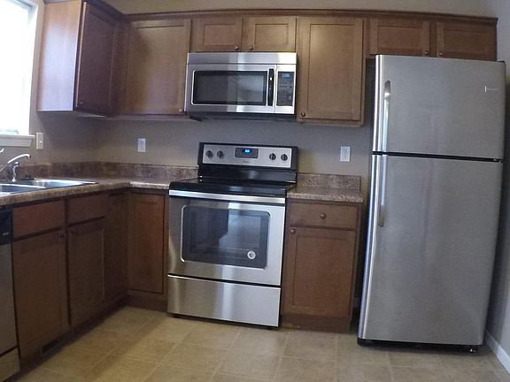 Kitchen includes new stainless steel appliances: Flat top st