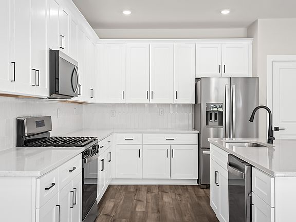 Each kitchen includes stainless-steel appliances