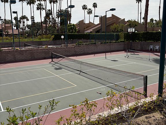 Two full size lighted tennis courts, one with 2 pickle board courts too. Even a hoop for a shoot around,