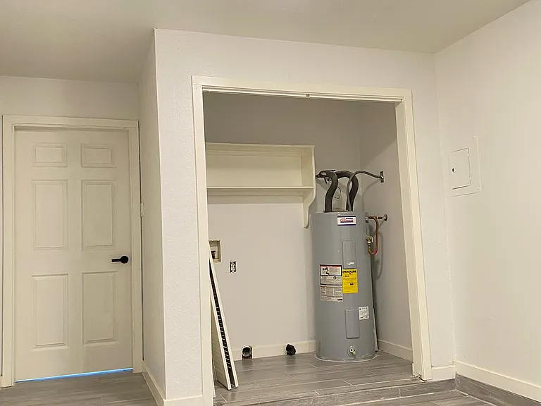 Enclose garage that will serve as laundry room and storage room