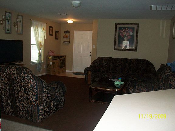 VIEW OF THE LIVING ROOM AREA FROM THE KITCHEN